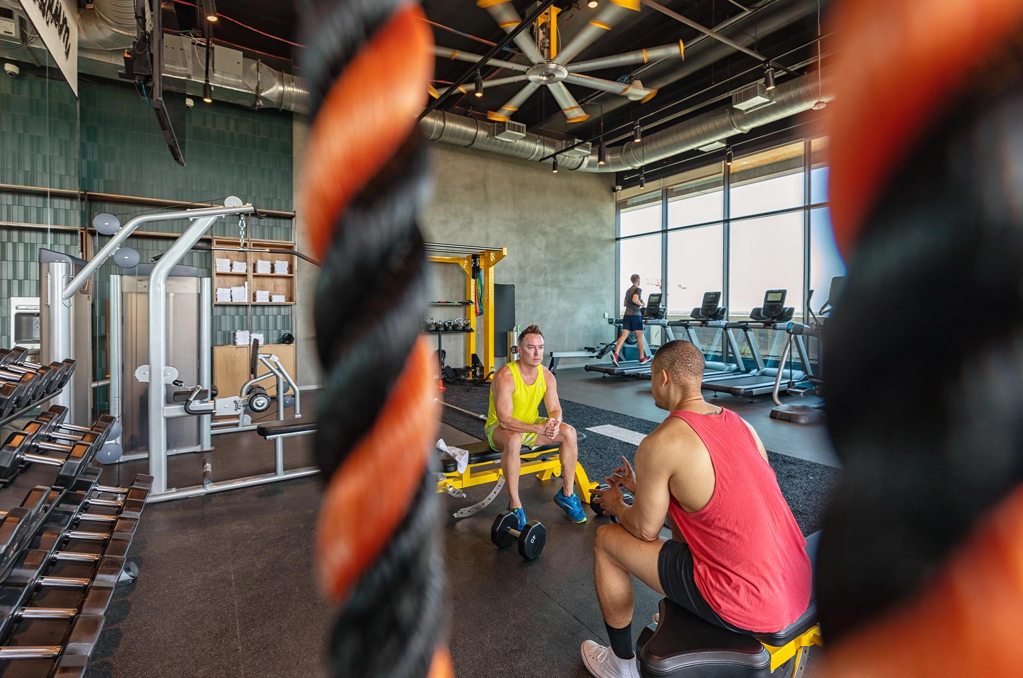 Two men working out in the gym