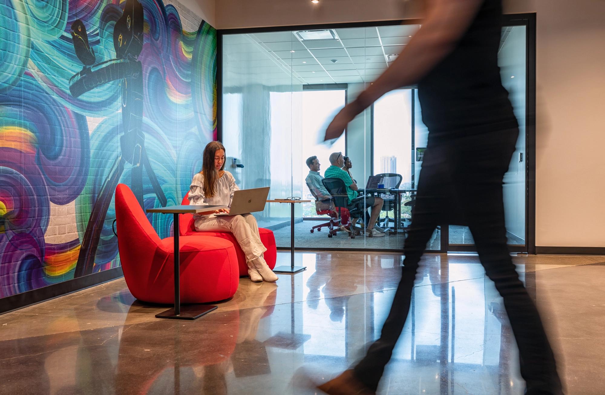 Woman working in a red chair