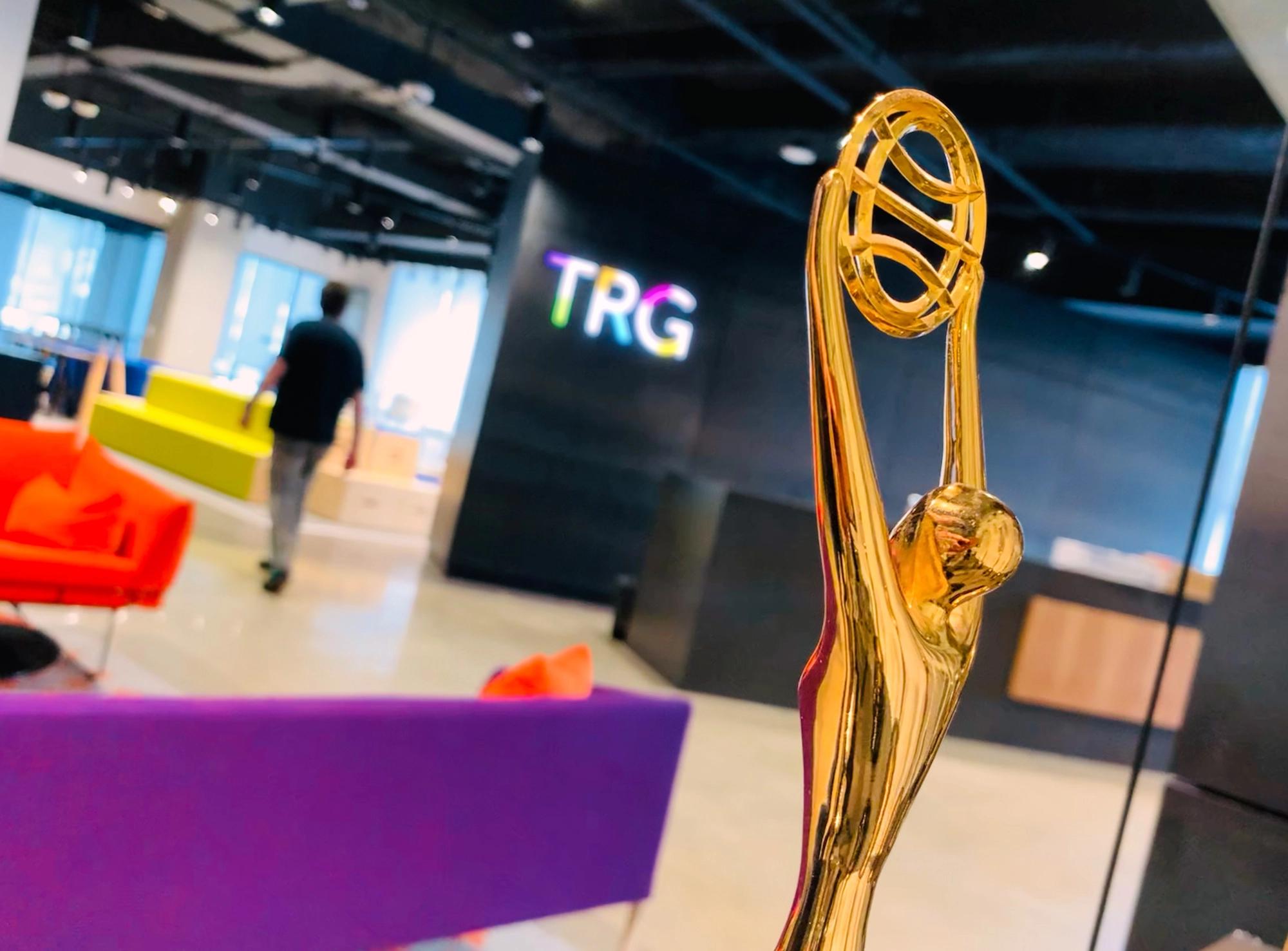 TRG lobby shot with award