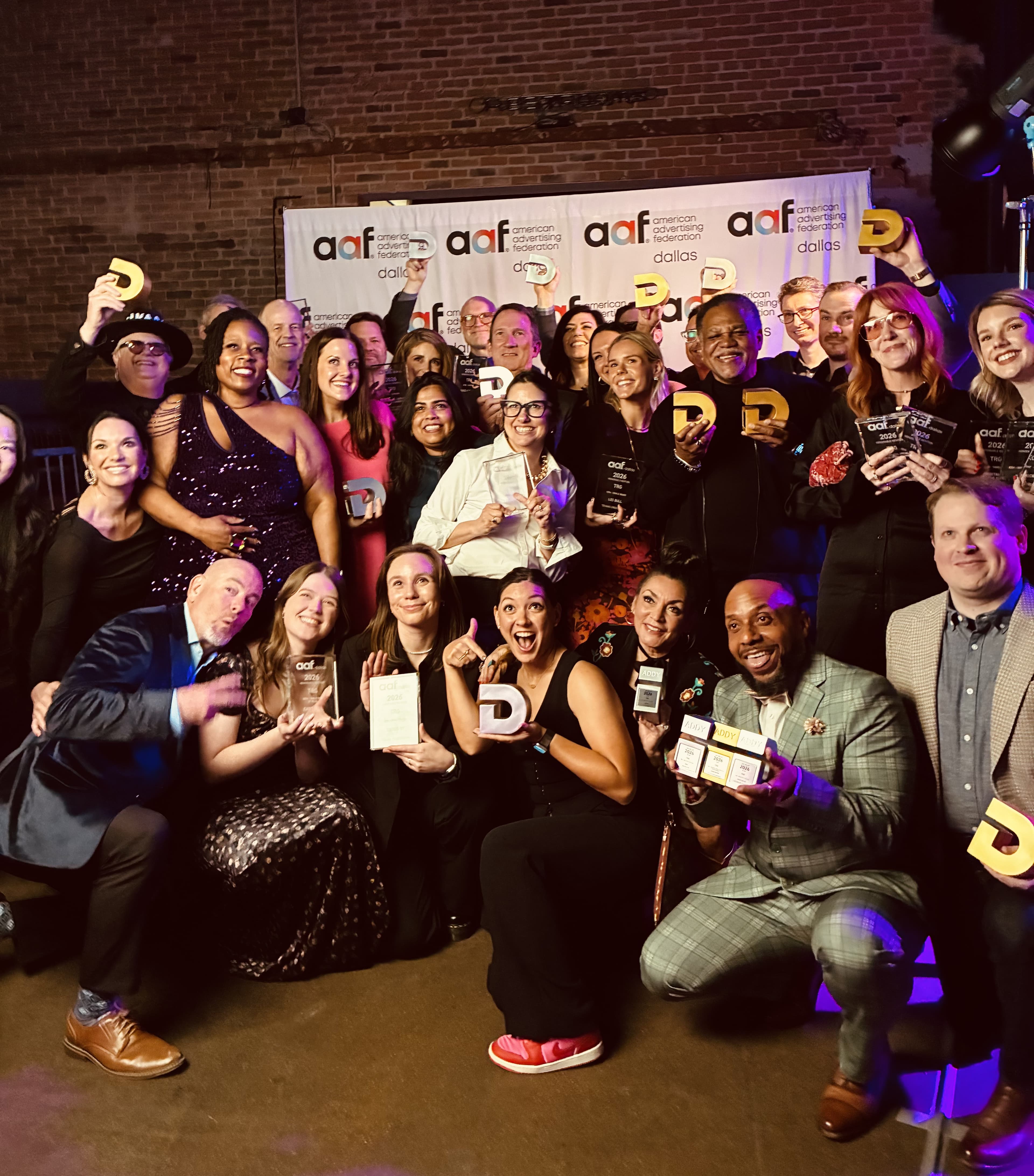 The team celebrating at an awards night
