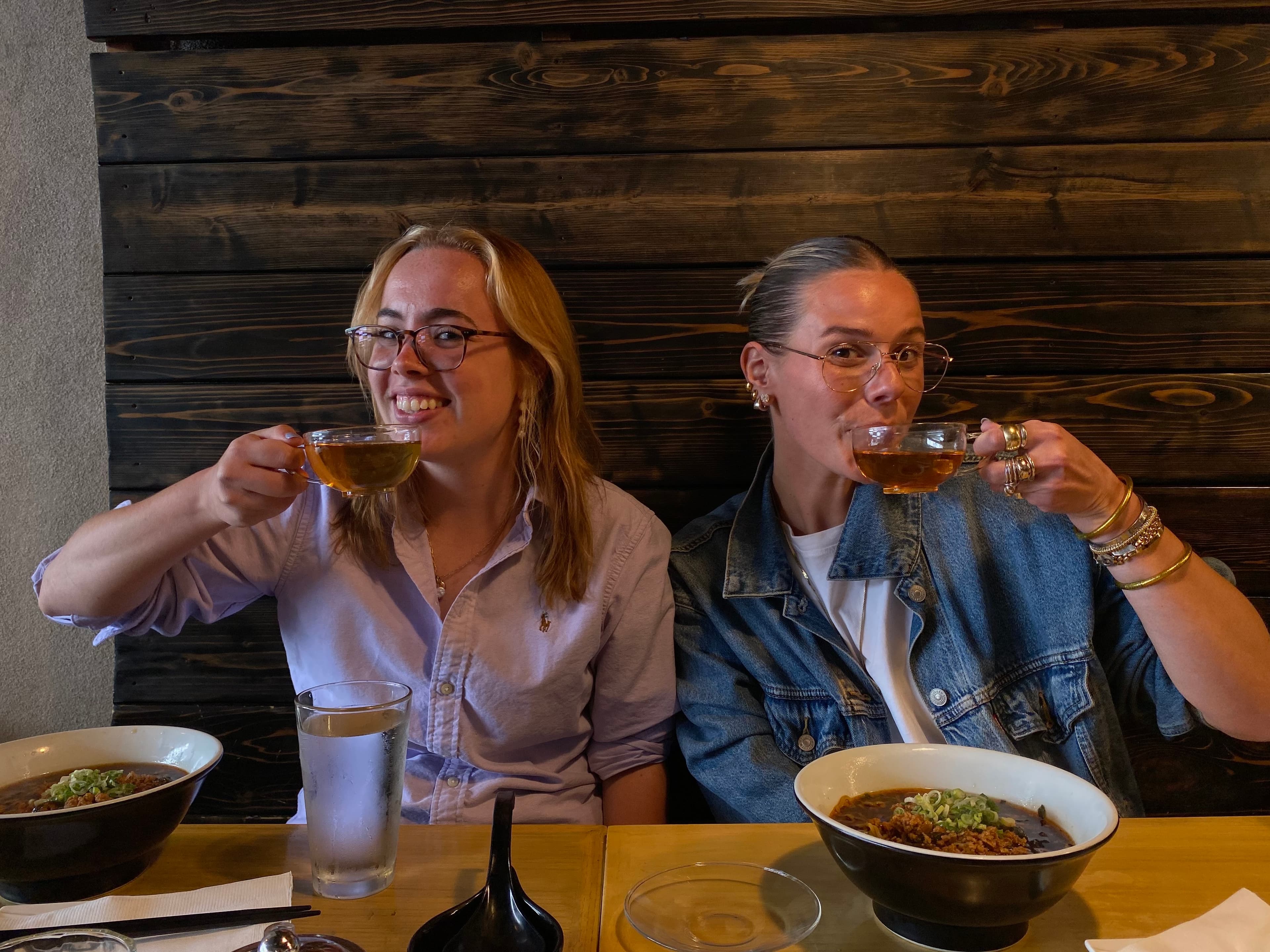 Two teammates sharing a toast